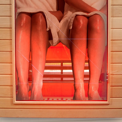 Red rubber boots inside a wooden box with a red background